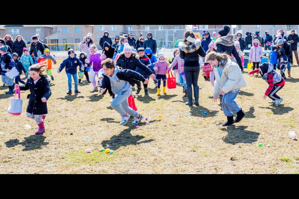 Kids make a mad dash for the Easter eggs hunt. Only two of the eggs would have the golden tickets for prizes. Paul Novosad for Bradford Today.