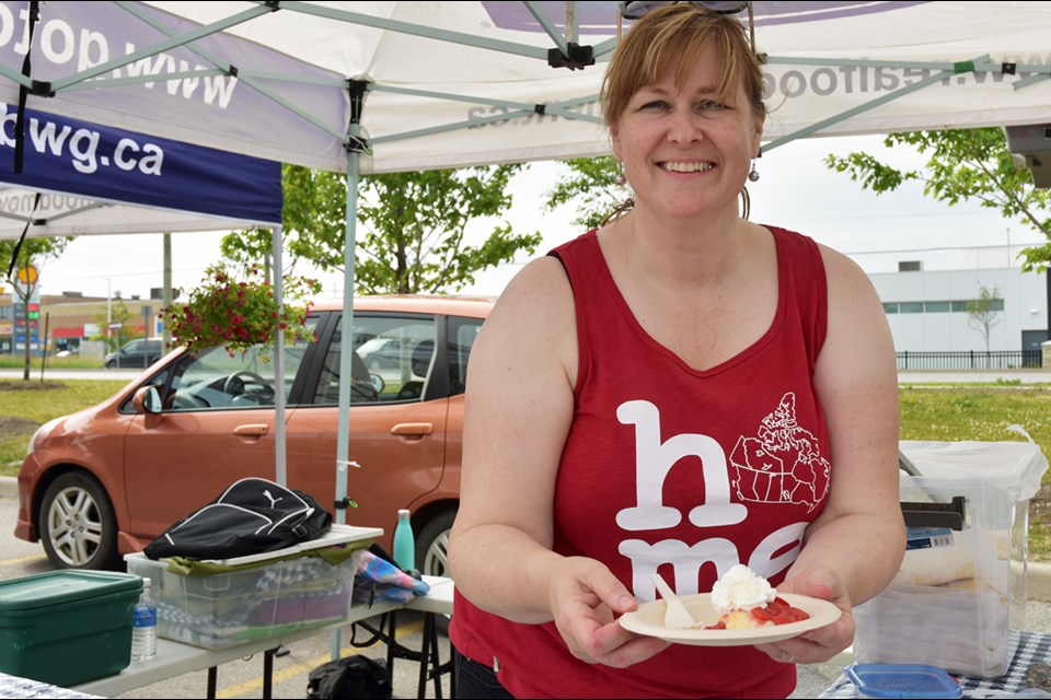 Laura Vree serves up Strawberry Shortcake, for the Strawberry Festival. Miriam King for BradfordToday