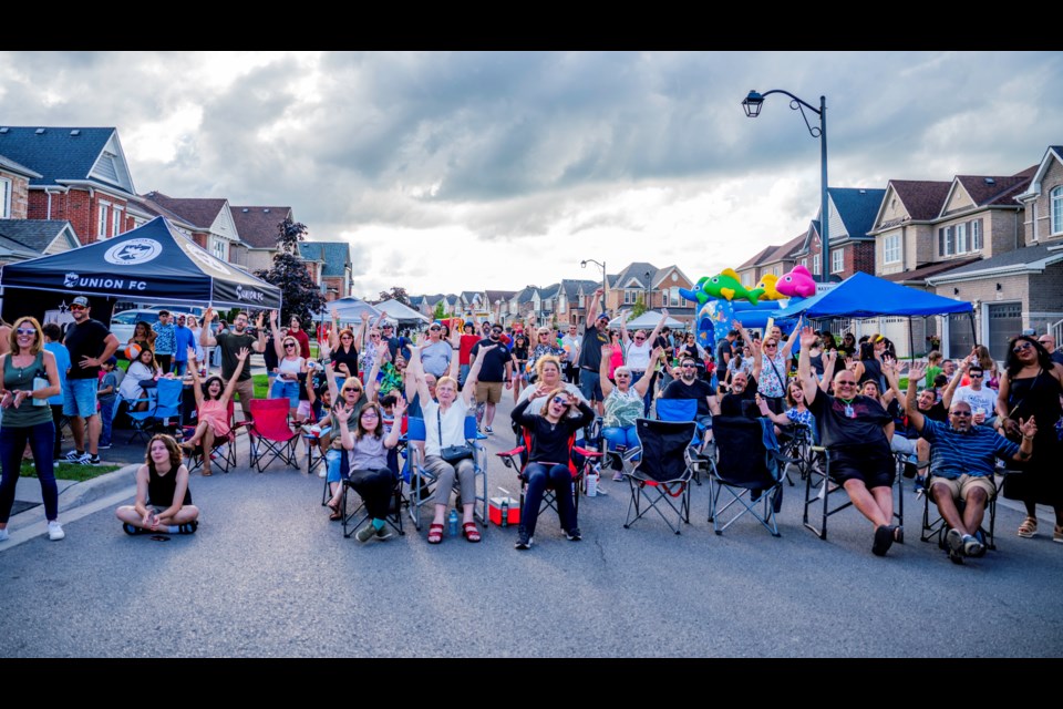 Enthusiastic music fans enjoying the bands at the second annual Summerlyn Retro Street Party on Saturday.