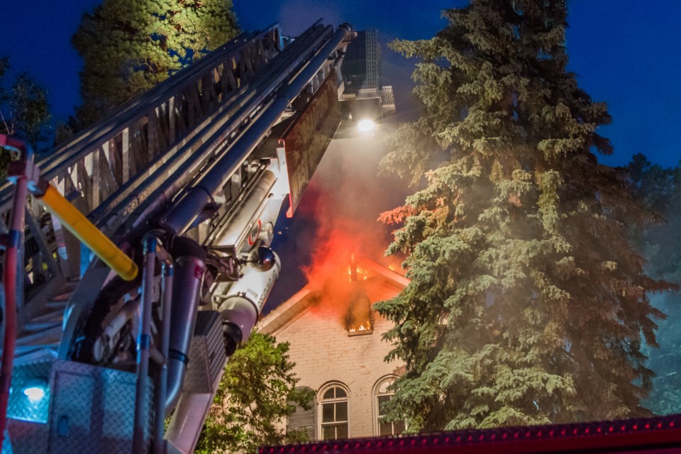 Bradford Fire setting up the Tower truck to tackle the fire now spreading through the roof. Paul Novosad for BradfordToday