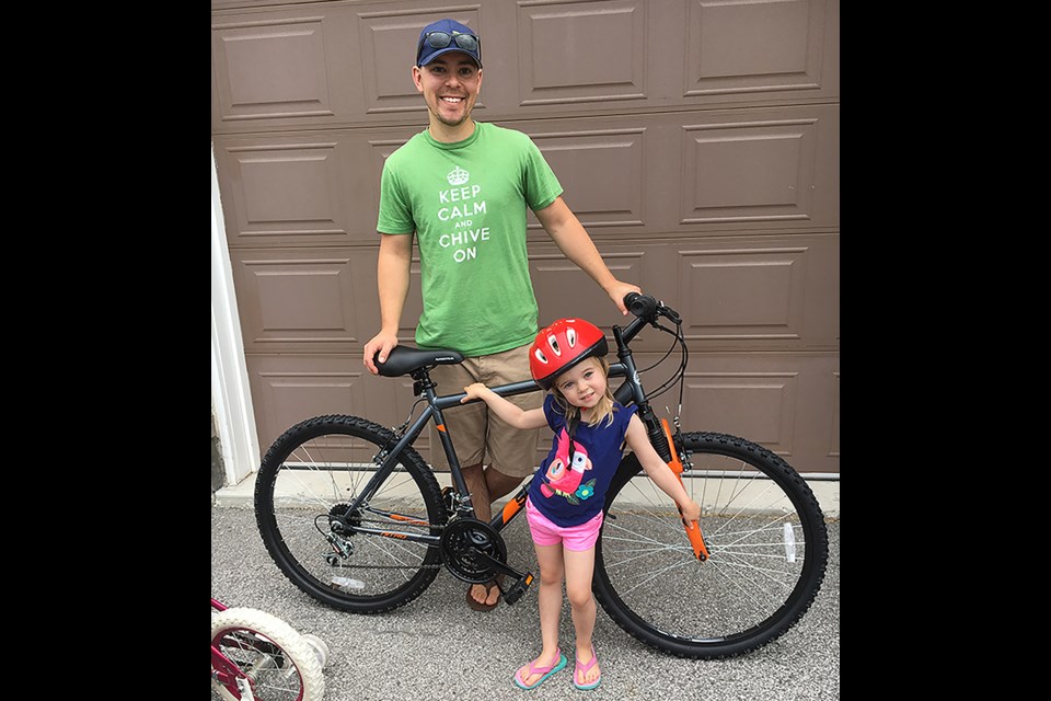 Jon Davies won a bike at Carrot Fest, to the delight of the family. Submitted photo 