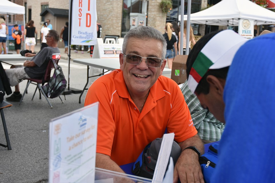 Deputy Mayor James Leduc mans the booth at Carrot Fest, on behalf of the Healthy Communities Advisory Committee. Miriam King/Bradford Today