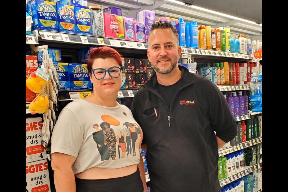 Donna Lutchman donated $500 US to the Helping Hand Food Bank after she was awarded a grant from her place of employment because of her volunteer efforts. She is pictured here with the owner of Reali No Frills in Bradford, Peter Reali.