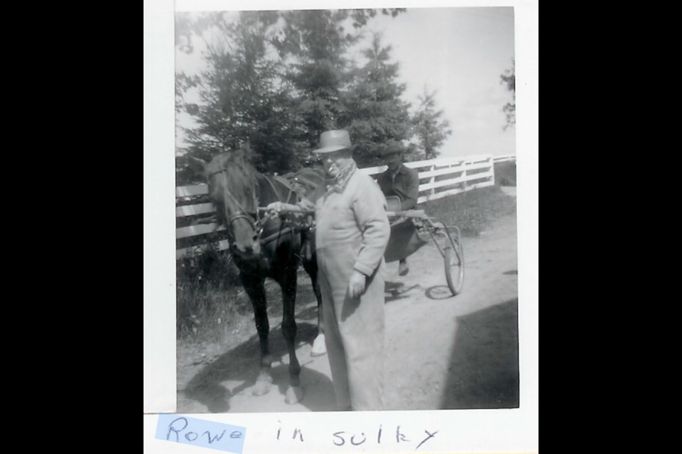 Earl Rowe is shown with his horse, Sulky.