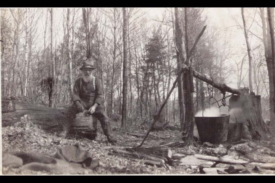 Before sugar shacks, boiling sap was done outside in a cast-iron pot over an open fire.