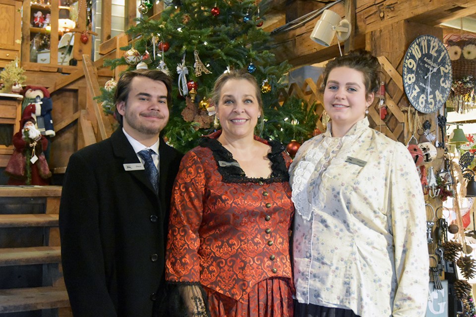 Diana Robinson, centre, with daughter Abigail and son Owen, celebrating a Victorian Christmas at the Cookstown Antique Market. Miriam King/BradfordToday