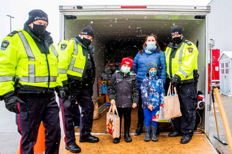 Xavier and Leo drop of their gifts in support of SSP's annual Toy Drive. Paul Novosad for Bradford Today.