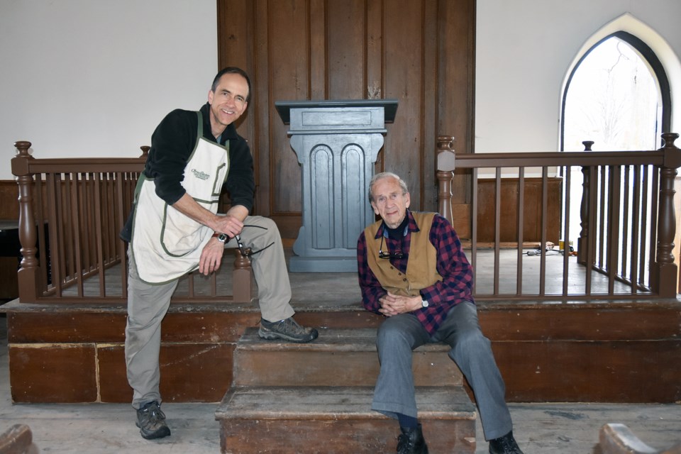 Bruce Chambers, left, and his father Dr. David Chambers, with new balustrade added to the stage at the Auld Kirk.