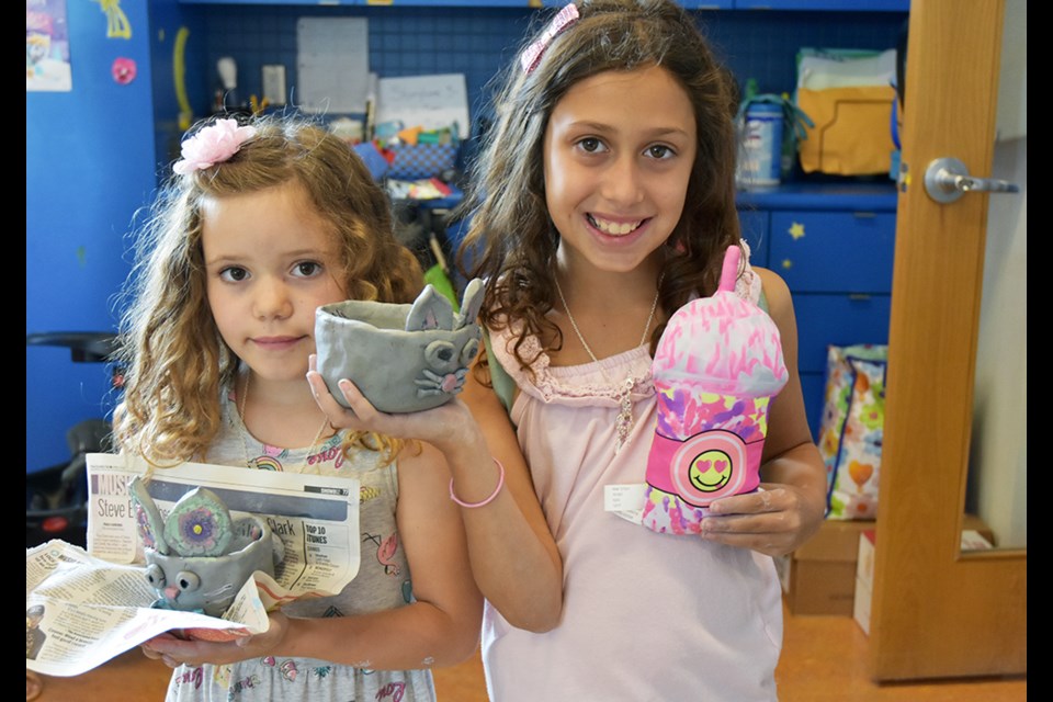 Kids proudly show off what they made at the BWG Public Library. Miriam King/Bradford Today