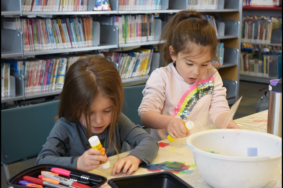 These kids enjoyed making art with glue and tissue paper, at the BWG Public Library Monday as March Break activities kicked off. Miriam King/Bradford Today
