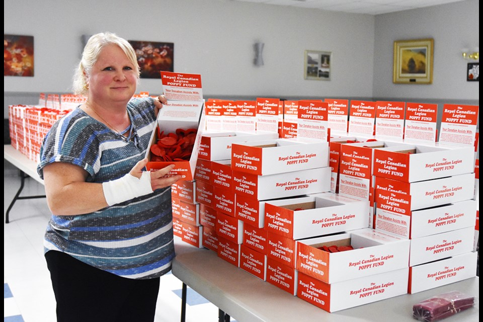 Tammy Paglia with poppy boxes, ready to send out into the community. Miriam King/BradfordToday