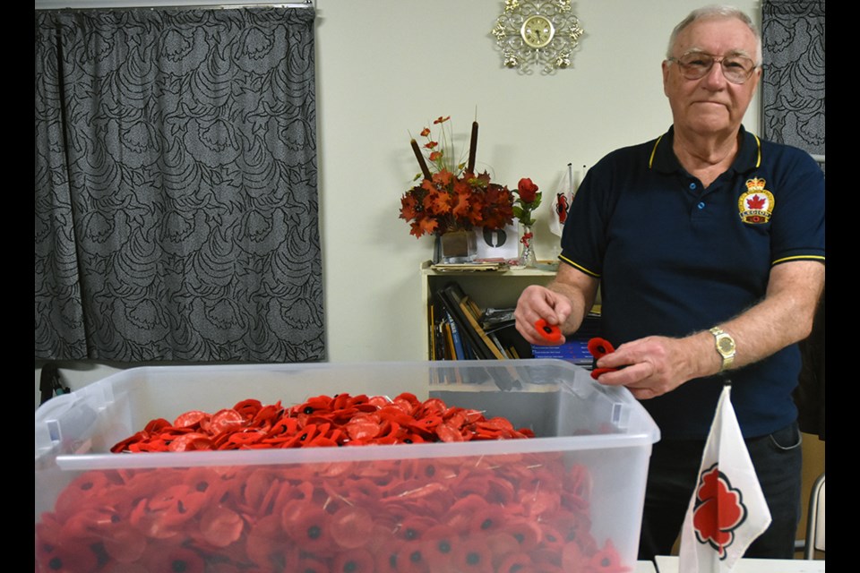 George Neilson gets some poppies ready for this year’s poppy campaign. Miriam King/BradfordToday