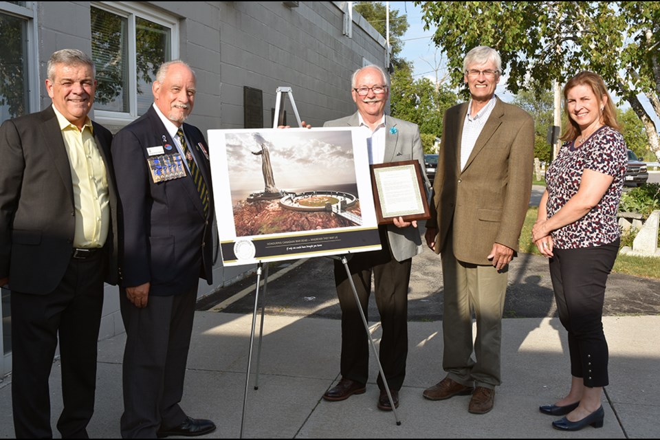 From left, Deputy Mayor James Leduc, Bradford Legion Past President Mike Giovanetti, Lt. Col. Ferguson Mobbs (Ret.), Mayor Rob Keffer, Town Clerk and Director of Corporate Services Rebecca Murphy, with artist's rendition of the Never Forgotten National Memorial, and Mother Canada monument. Miriam King/Bradford Today
