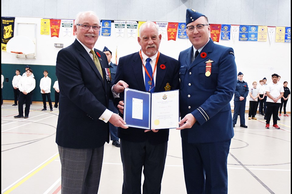 Lt. Col. (Ret.) Ferguson Mobbs, left, of the RCAC Provincial program, and Capt. JP Johnson present a Certificate of Merit to Mike Giovanetti for his efforts in support of the new Bradford Air Cadet Squadron. Miriam King/Bradford Today