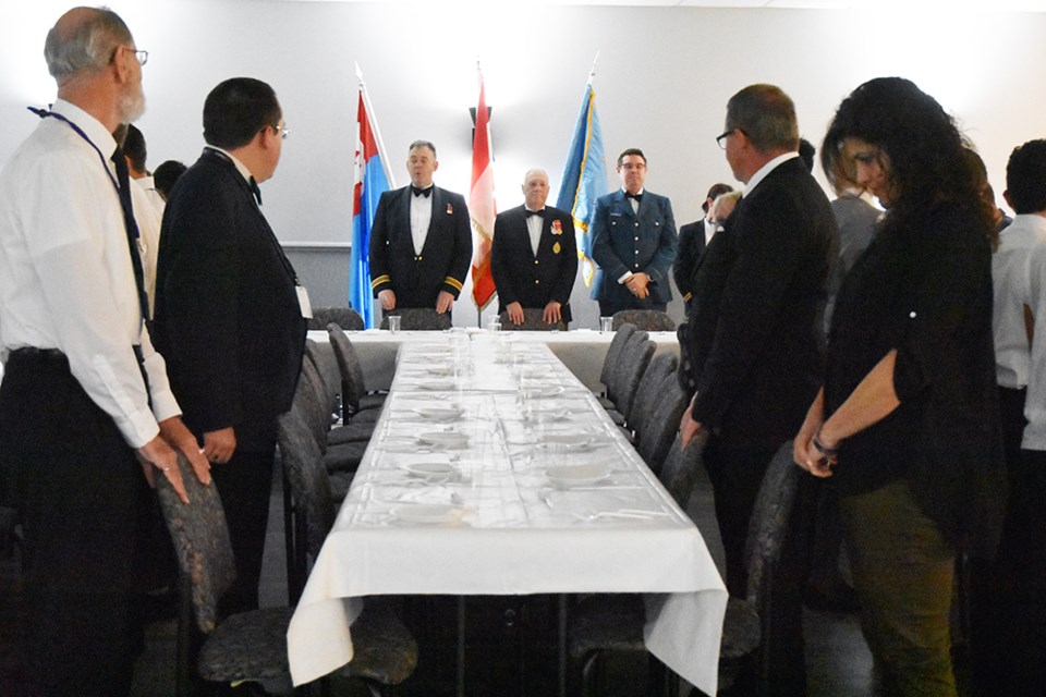 All stand until the head table is seated, at a Mess Dinner. Miriam King/Bradford Today