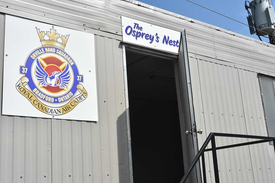 Crest of 37 Bradford Air Cadet Squadron, featuring an Osprey, proudly hangs on the entrance to the trailer, parked at the Bradford Legion. Miriam King for Bradford Today