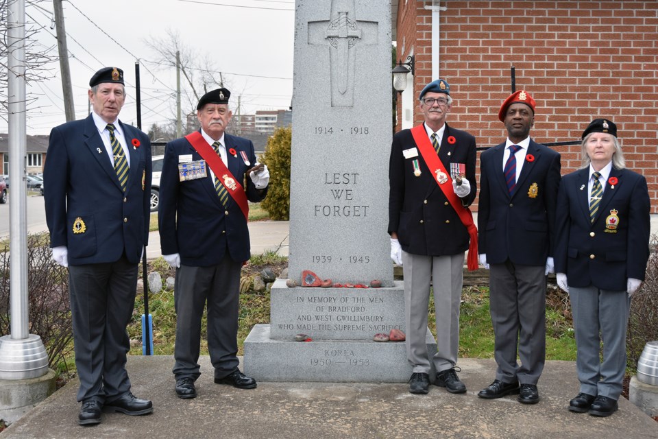 At the Bradford Legion Cenotaph on Vimy Ridge Day, from left: Aurora Legion's Brenden Hawley, Bradford's Mike Giovanetti, Lefroy-Belle Ewart Legion's Denis Mainville and Dan Dixon, Aurora's Nancy Gradeen.