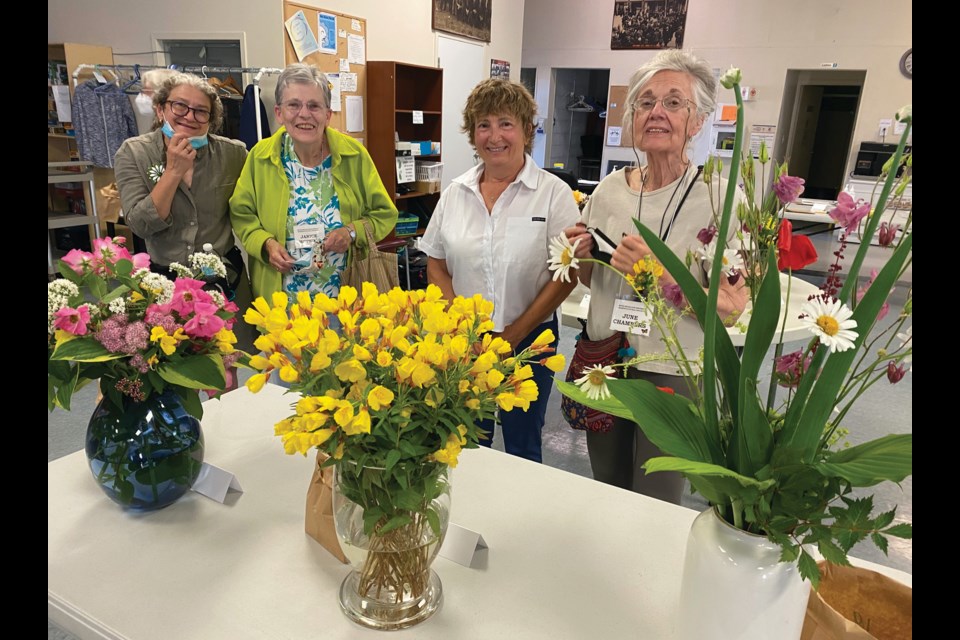 The Bond Head/Bradford Garden Club met on Thursday at the Danube Seniors Leisure Centre. The theme was Garden Flowers Arrangements, with a demonstration by Sobeys florist Linda Williams, and a beautiful array of arrangements presented by members and friends. Here, Michelle, Janice, Linda and June admire the evening's entries.