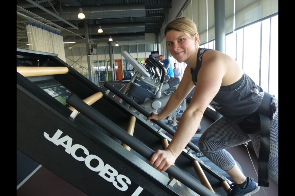 Stephanie Uren, fitness supervisor at the BWG Leisure Centre, demonstrates how to use the Jacobs Ladder. Jenni Dunning/BradfordToday