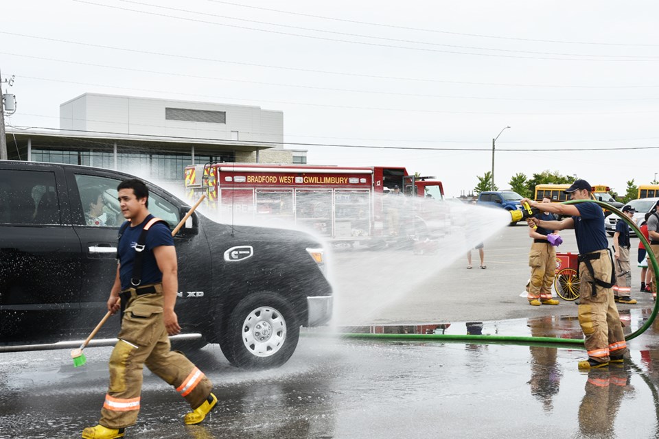 Volunteer firefighters hold their annual fundraising car wash at Canadian Tire in Bradford on June 9. Miriam King/Bradford Today