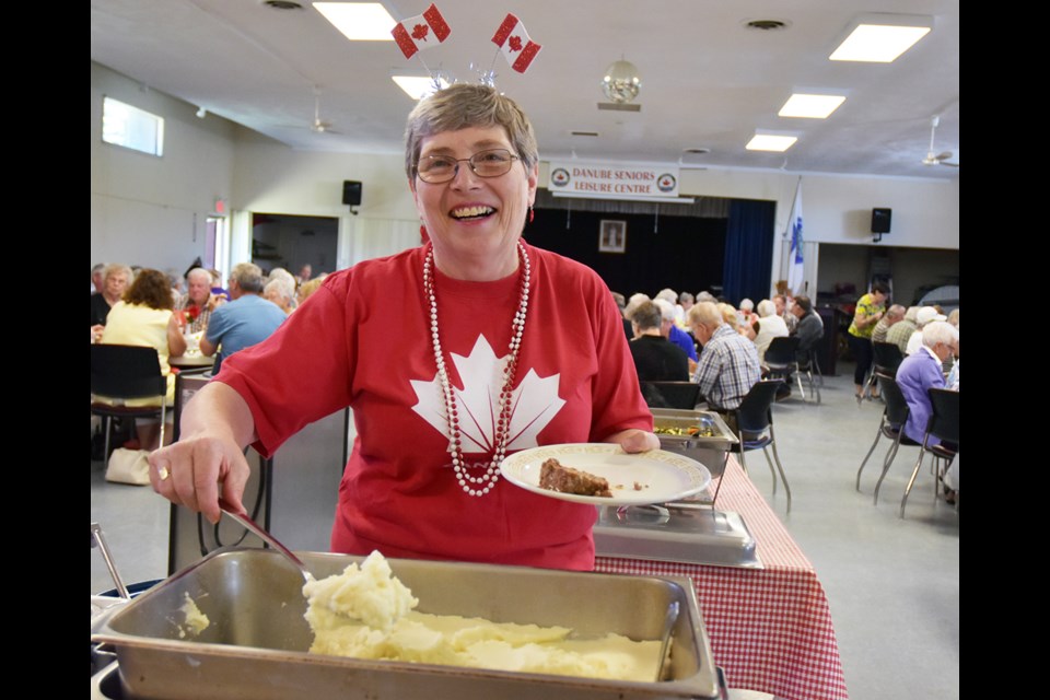 A festive Jan Evans serves up mashed potatoes at the Danube Seniors Leisure Centre. Miriam King/Bradford Today