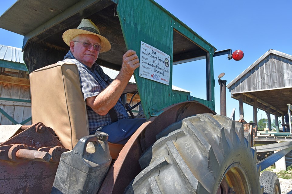 Bill Vernon  of Bradford West Gwillimbury behind the wheel of the 1945 McCormick-Deering WD-9 used to power the sawmill at the Georgian Bay Steam Show grounds. Miriam King/Bradford Today