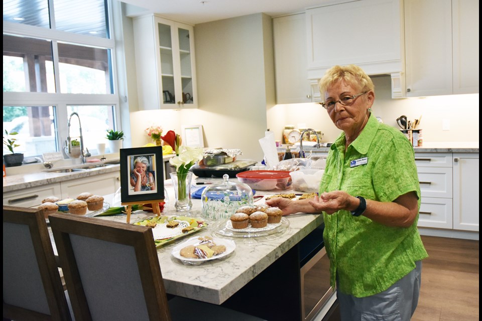 Volunteer Jackie Maher places muffins on a plate, in Kathy’s Kitchen at Matthews House Hospice. Miriam King/BradfordToday