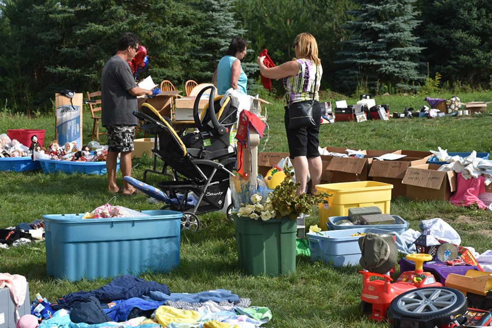 Hunting for bargains at the giant yard sale, held at New Life Baptist Church. Miriam King/BradfordToday