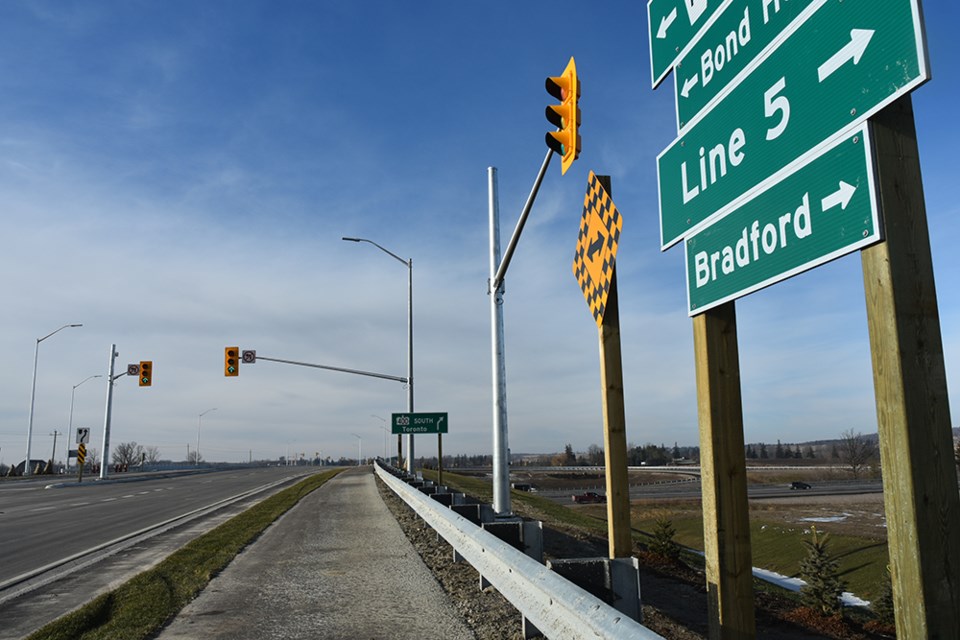 Looking west on Line 5, toward the  new bridge, lights and off-ramp at the Highway 400 interchange. Miriam King/Bradford Today