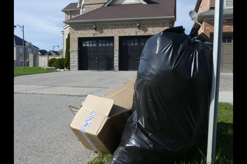 Garbage at the side of the road next to a house in Bradford West Gwillimbury known as an Airbnb party house by neighbours. Jenni Dunning/BradfordToday