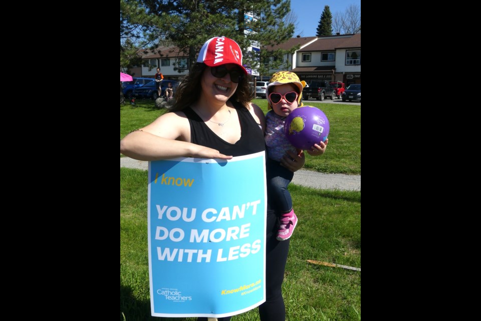 Protesting Newmarket teacher Christina Sottile, and her one- year-old daughter, Carina. Jenni Dunning/BradfordToday