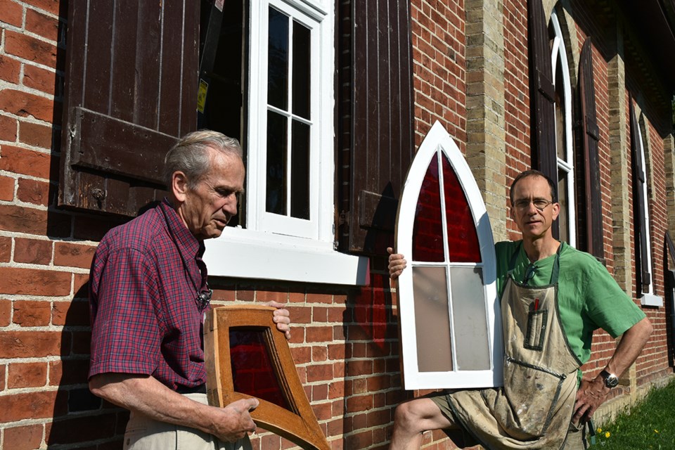 David Chambers, left, and son Bruce Chambers working on the restoration of the windows at the Auld Kirk. Miriam King/Bradford Today