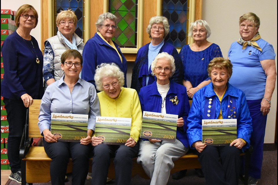 Members of the Bond Head Women's Institute with their fundraising calendar on the landmarks of Bradford West Gwillimbury. Miriam King/Bradford Today