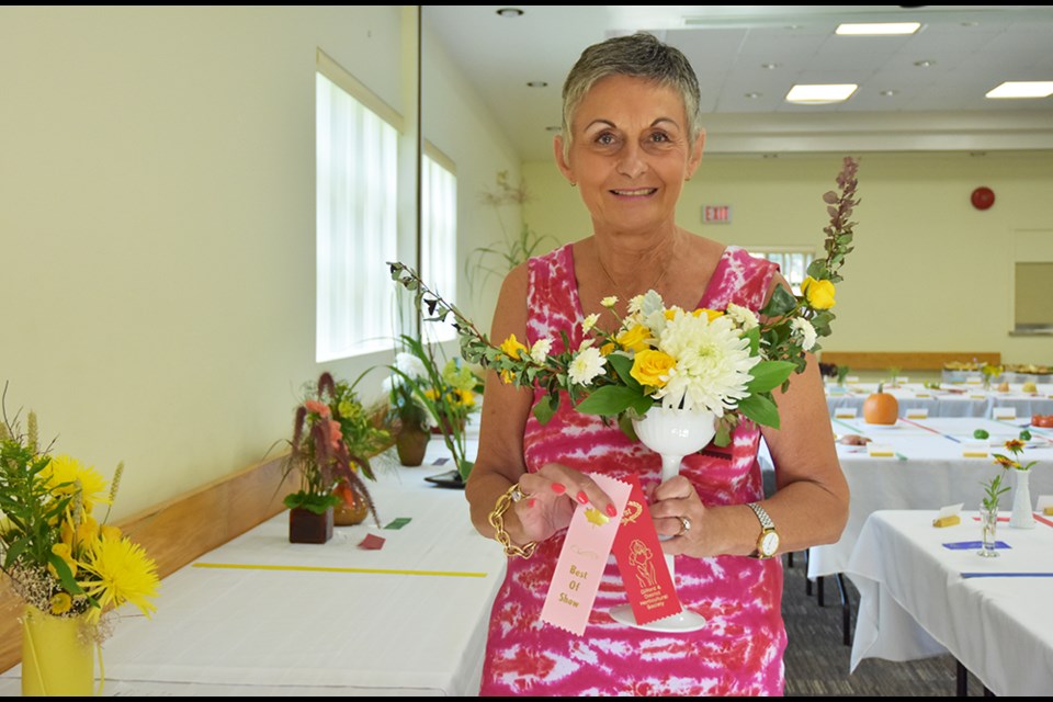 Agnes More with her prize winning floral arrangement, Harvest Moon. Miriam King/BradfordToday