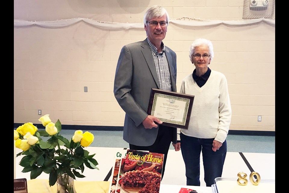 Bradford West Gwillimbury Mayor Rob Keffer presents a certificate congratulating Leila Lloyd on her 80th Birthday. Submitted photo 