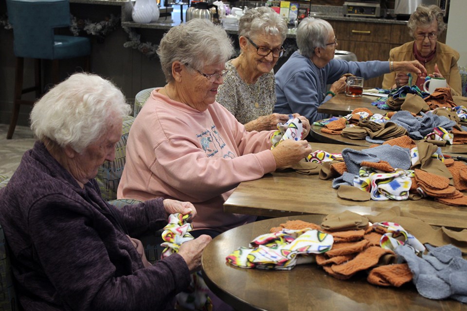 Residents of The Elden Retirement Residence get together to make scarves for those in need this holiday season. SUBMITTED
