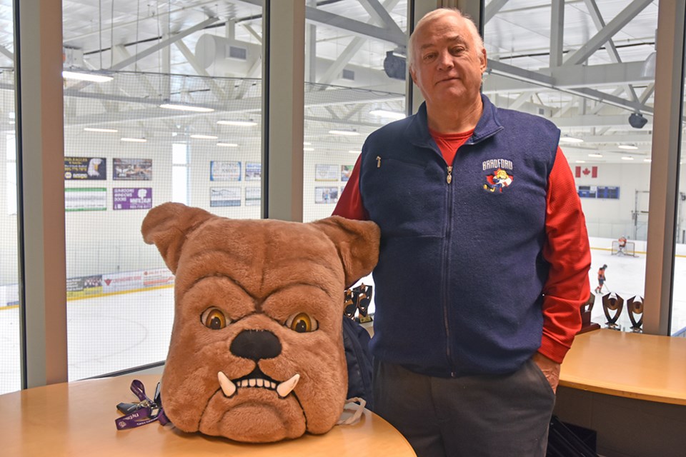 Paul Dossey, president of the BWG Minor Hockey Association, at the BWG Leisure Centre's Blue Rink, with 'Bulldog' mascot. | Miriam King/Bradford Today file