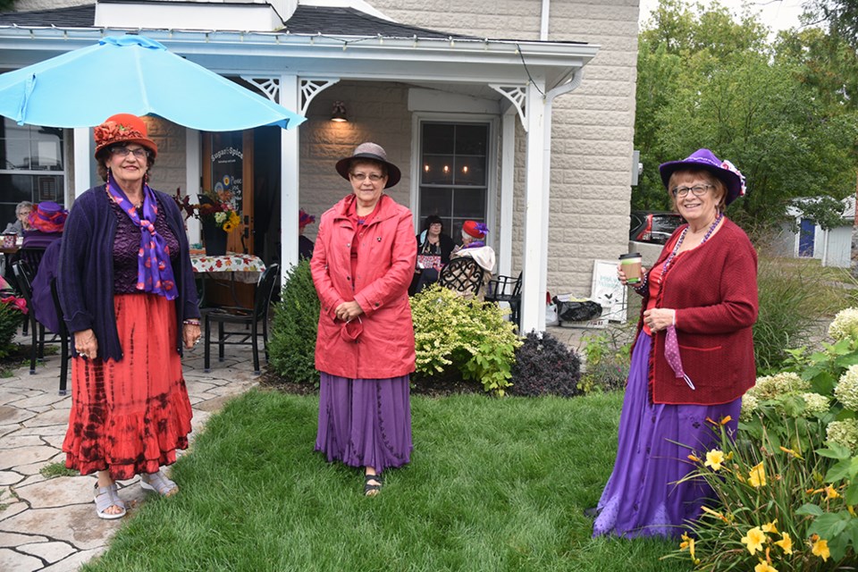 Red Hat Royal Court - from left, Connie Mackenzie-Morgan, Bonnie MacTaggart and Lynda Usher, at Sugar and Spice Bakeshop in Schomberg. Miriam King for Bradford Today