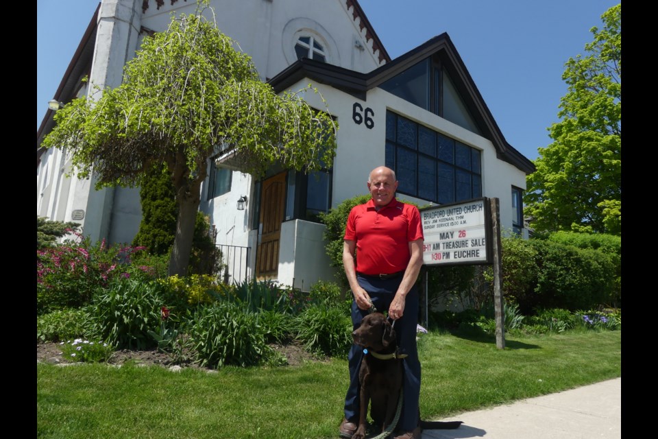 Bradford United Church Rev. Jim Keenan, with dog O'Malley, said the Barrie Street church will host a celebration June 10.