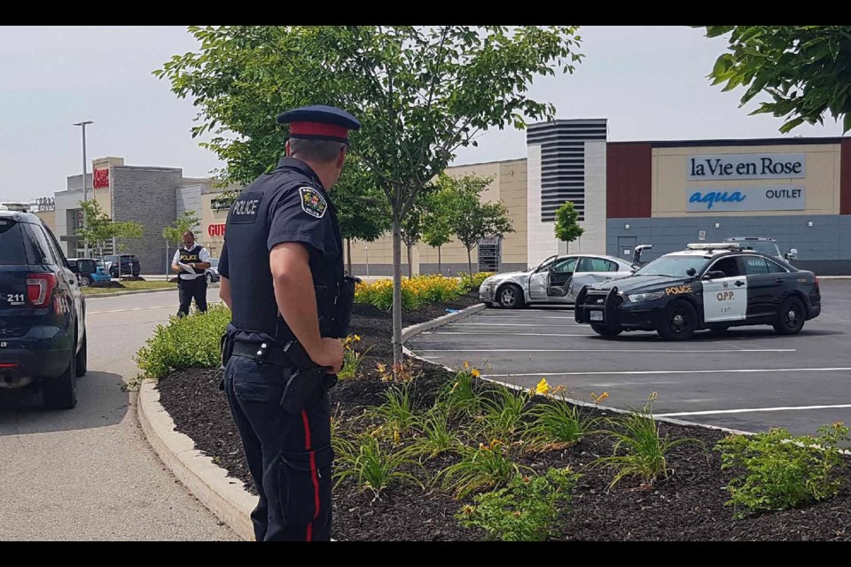 South Simcoe Police investigate after a hit-and-run crash turned into an arrest at Tanger Outlets in Cookstown. Sue Sgambati/South Simcoe Police