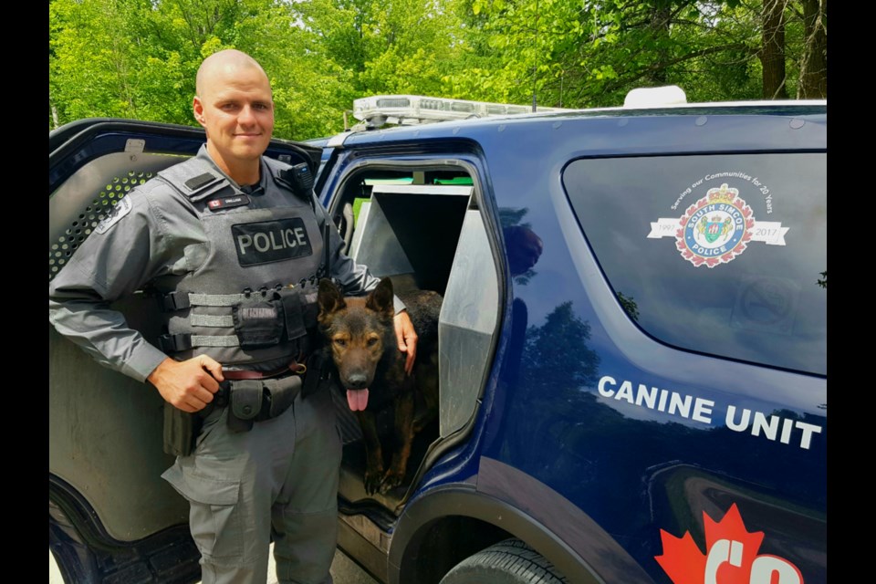 South Simcoe Police Const. Shawn Gwilliam and Nitro the police dog. Submitted photo 