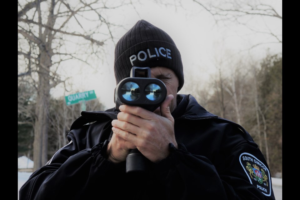 South Simcoe Police Const. Paul Catling, pictured with a radar gun, said officers make more stunt driving charges when warmer temperatures arrive for spring. Submitted photo 