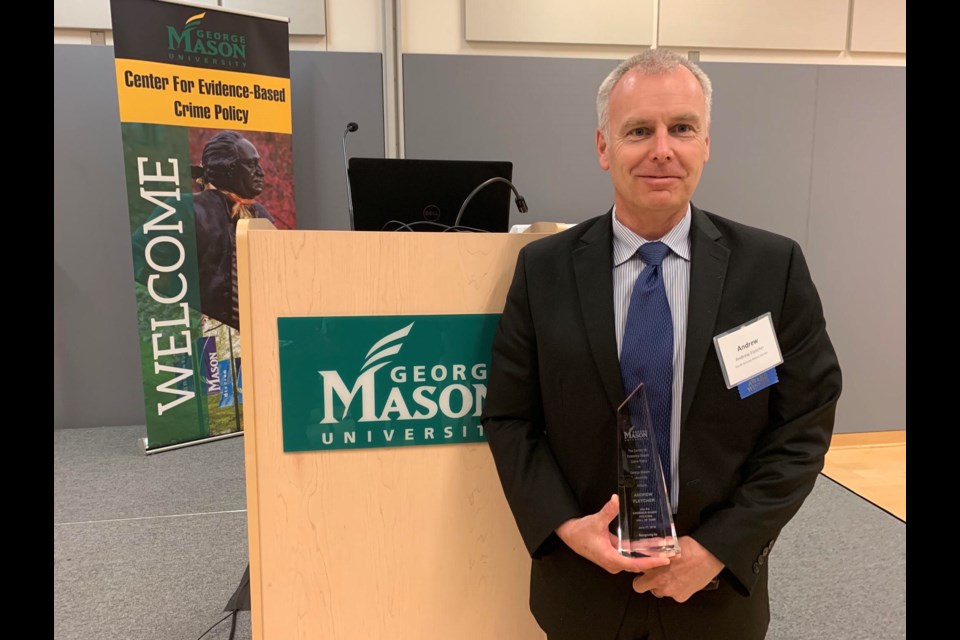 South Simcoe Police Chief Andrew Fletcher with his award inducting him into the Evidence-Based Policing Hall of Fame. Submitted photo/Twitter