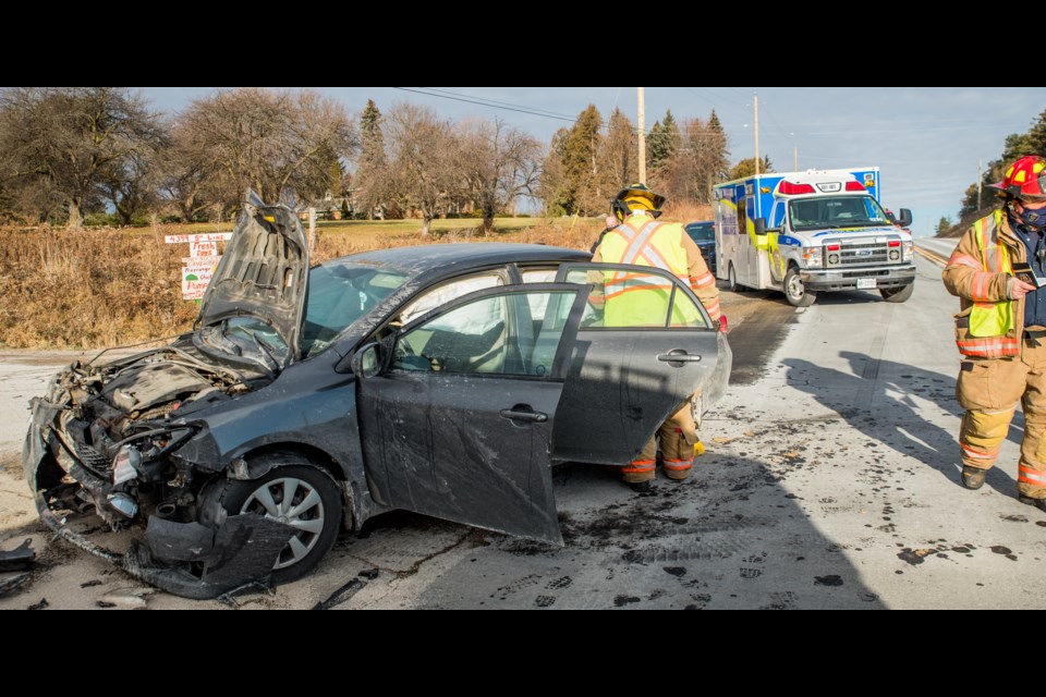 Heavily damage car sits on Hwy 27 after being in a collision with a transport truck. Paul Novosad for Bradford Today.