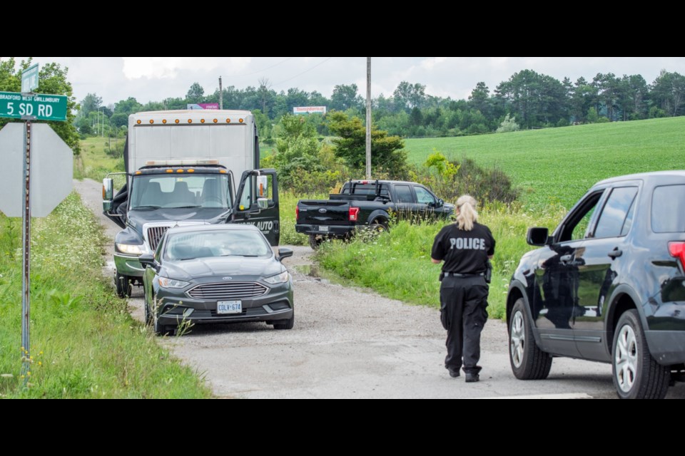 In a field at the 5th Sideroad and 10th Line in Bradford West Gwillimbury, OPP and York Regional Police recovered the black Ford F150 pick-up truck linked to a shooting in Vaughan Aug. 2. Paul Novosad for BradfordToday