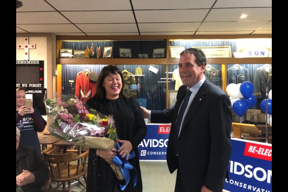 Scot Davidson thanks his wife Suzanne with a bouquet of flowers. Natasha Philpott/BradfordToday