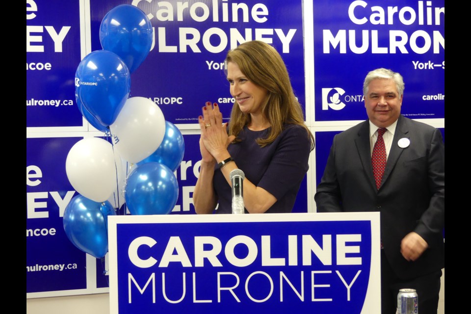 York-Simcoe MPP candidate Caroline Mulroney, left, turns to thank her parents for their support, while (now former) York-Simcoe MP Peter Van Loan looks on. Jenni Dunning/Bradford Today