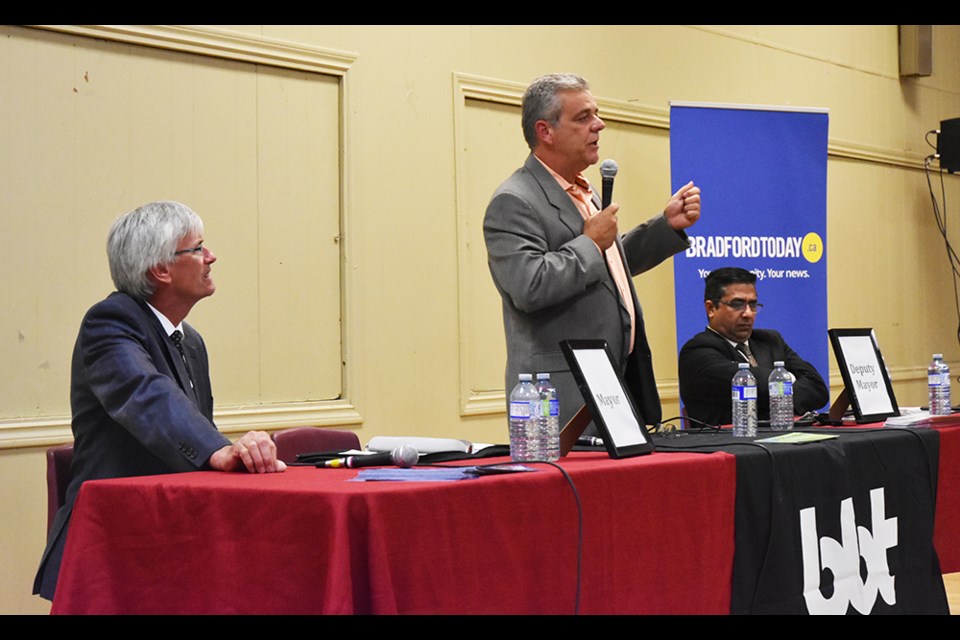 Candidate for Deputy Mayor James Leduc (incumbent) stands to answer a question, joined at table by mayoral candidate Rob Keffer, left, and candidate for deputy mayor Iftikhar Ahmad. Mayoral candidate Pat Roberge was unable to attend. Miriam King/BradfordToday