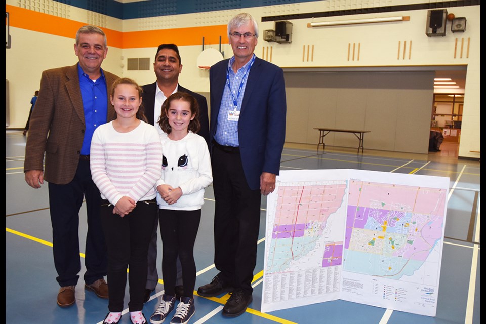 Chief Electoral Officers Lanna (front, from left) and Cady thank candidates James Leduc (back, from left) and Iftikhar Ahmad, and Rob Keffer for attending the assembly on Oct. 16. Miriam King/BradfordToday