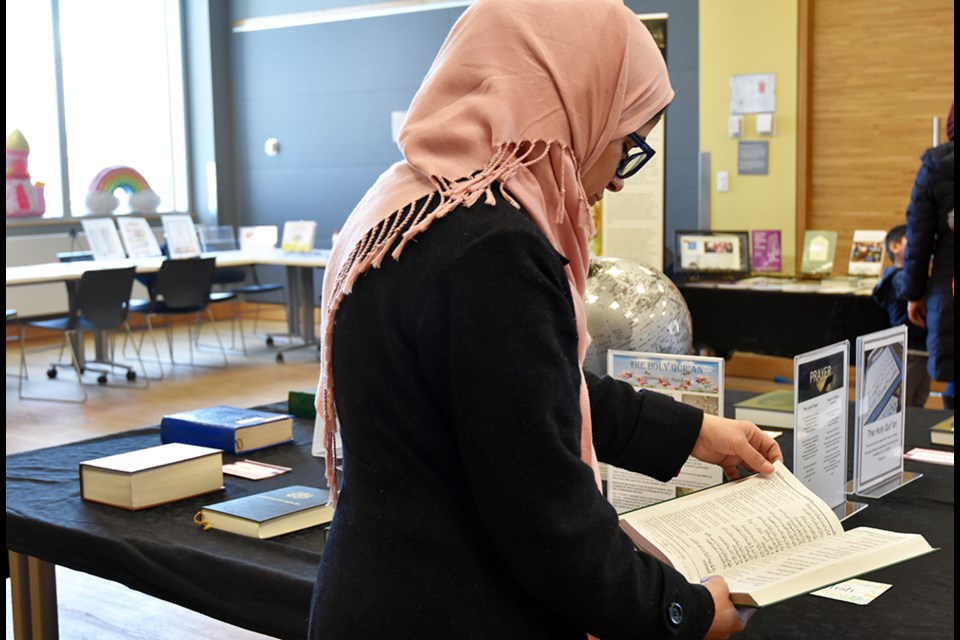 Aisha Tasneem reads a translation of the Holy Quran, at the Bradford Library. Miriam King/Bradford Today